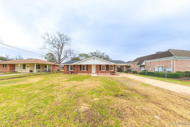 single story home featuring driveway, covered porch, fence, a front lawn, and brick siding