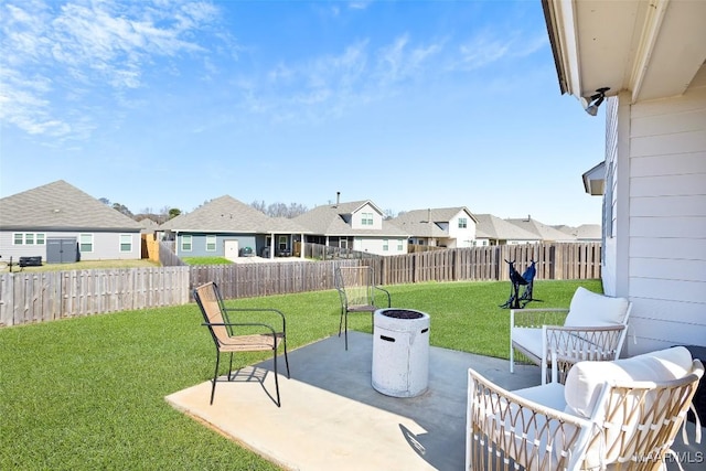 view of patio / terrace featuring a residential view and a fenced backyard