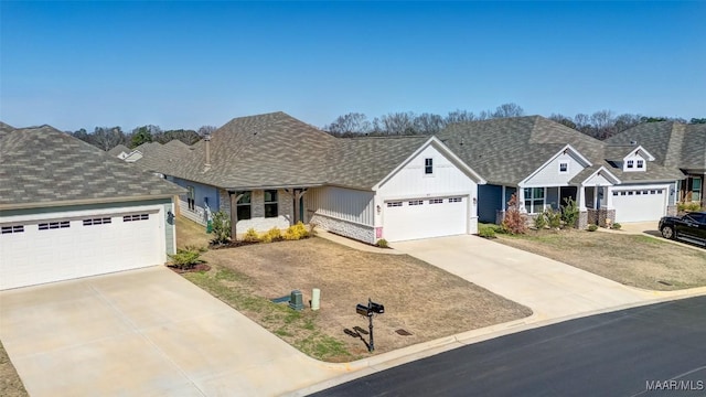 view of front of house with driveway, a residential view, board and batten siding, and brick siding