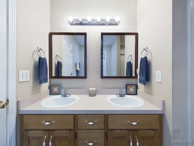 bathroom featuring double vanity and a sink