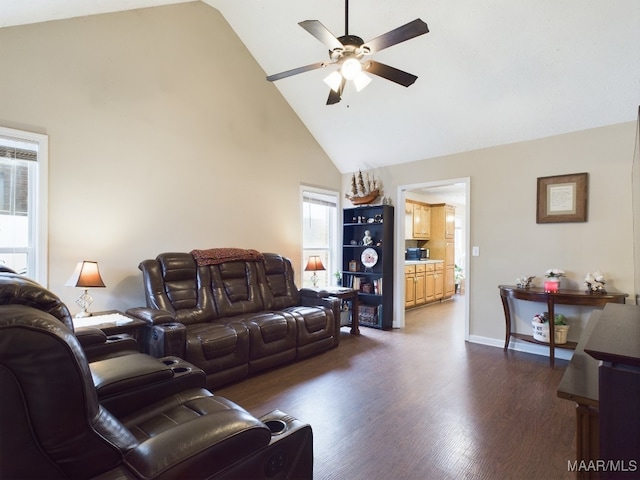 living area with baseboards, high vaulted ceiling, dark wood finished floors, and a ceiling fan