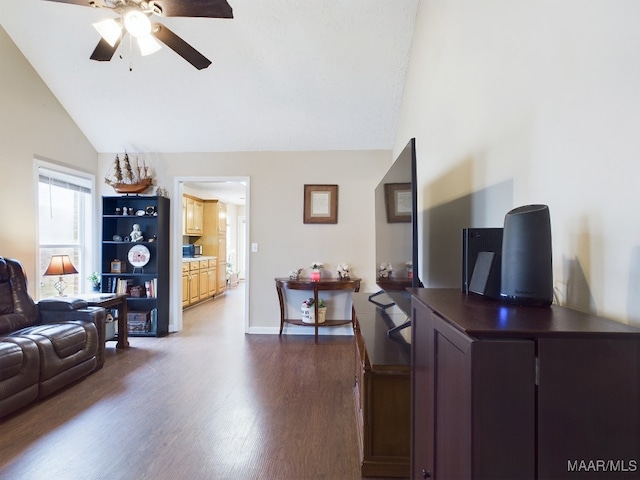 living room featuring high vaulted ceiling, baseboards, a ceiling fan, and dark wood-type flooring