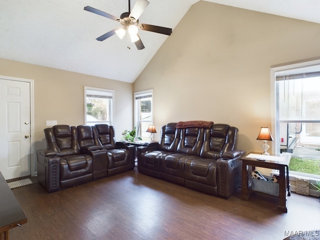 living room with ceiling fan, high vaulted ceiling, and dark wood-style flooring