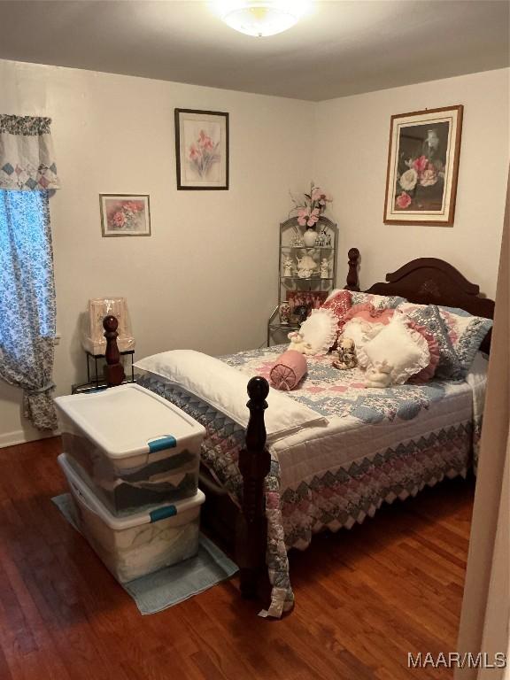 bedroom featuring wood finished floors