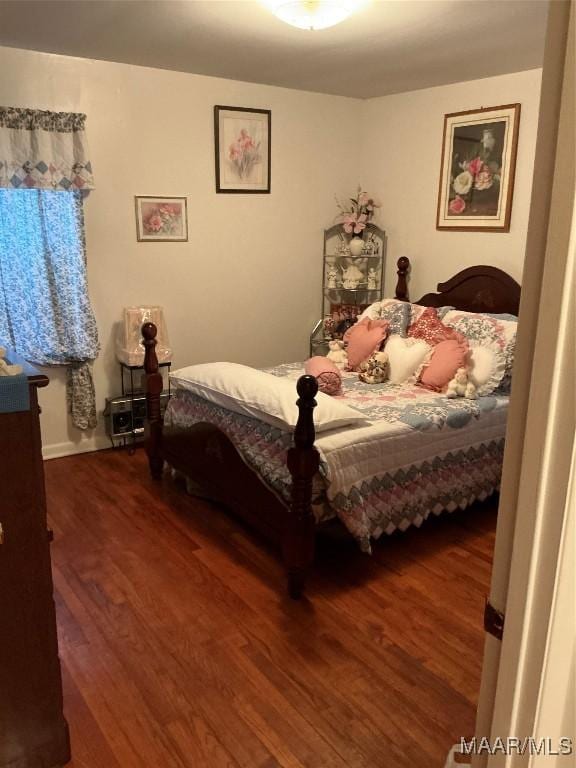 bedroom featuring wood finished floors