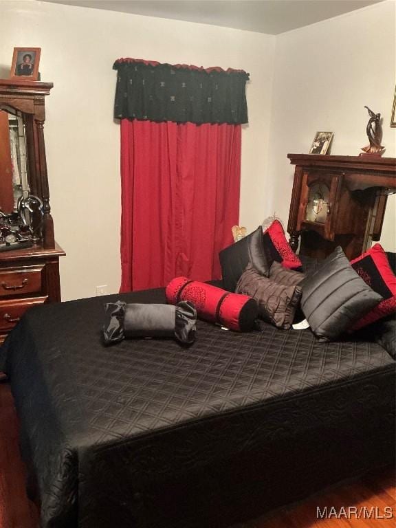 bedroom featuring wood finished floors