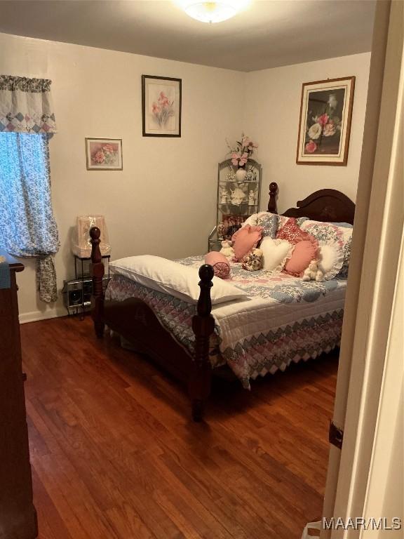 bedroom featuring wood finished floors