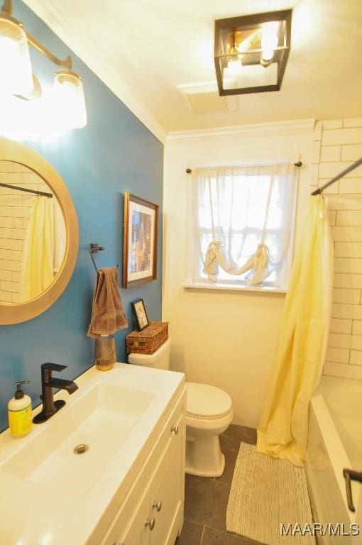 full bathroom featuring tile patterned flooring, toilet, vanity, ornamental molding, and shower / bath combo with shower curtain