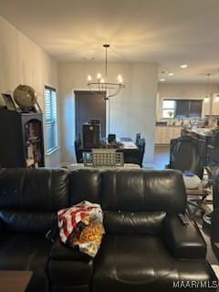 living room featuring an inviting chandelier