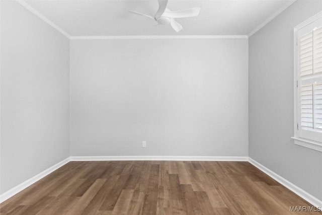 empty room featuring baseboards, ornamental molding, a ceiling fan, and wood finished floors