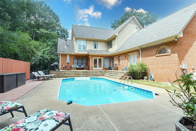 view of swimming pool with a patio, fence, and a fenced in pool