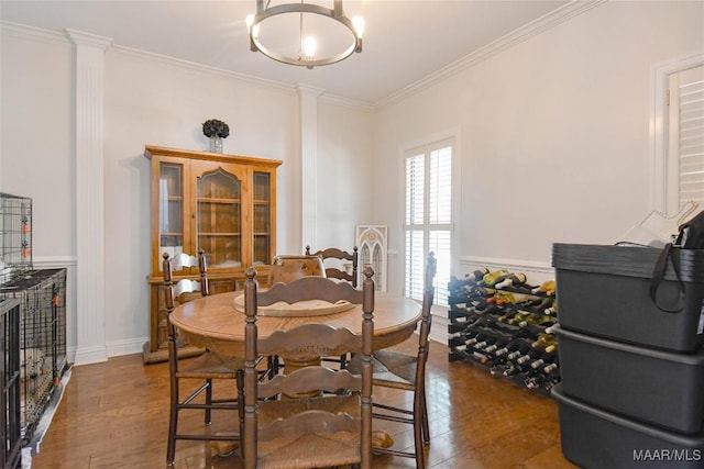 dining room featuring ornamental molding, dark wood finished floors, and baseboards