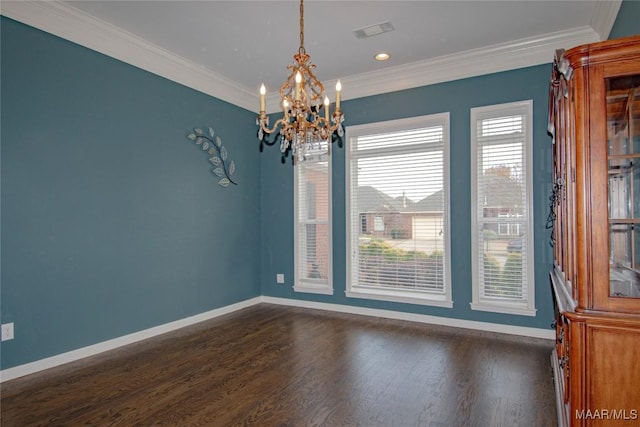 empty room with visible vents, crown molding, and baseboards