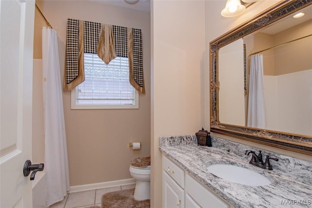 bathroom with baseboards, toilet, a shower with curtain, tile patterned flooring, and vanity