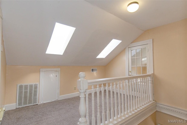 bonus room featuring baseboards, visible vents, vaulted ceiling, and carpet flooring