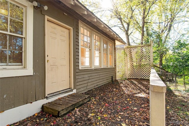 view of home's exterior with fence