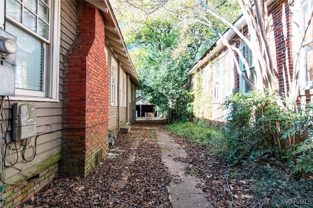 view of property exterior featuring brick siding