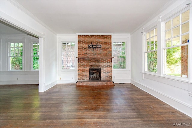 32 S Madison Ter, Montgomery, AL 36107 - unfurnished living room featuring ornamental molding, hardwood / wood-style floors, and a brick fireplace