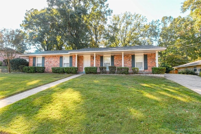 single story home featuring brick siding and a front yard