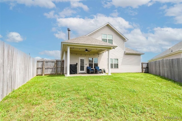 back of property featuring a yard, a fenced backyard, ceiling fan, and a patio