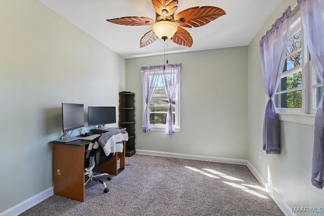 carpeted home office featuring ceiling fan and baseboards