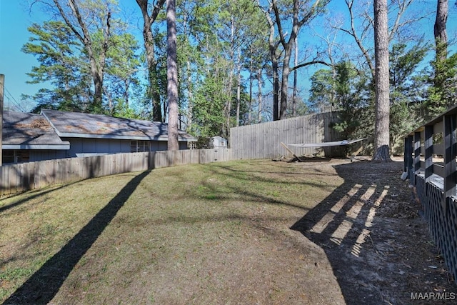 view of yard with a fenced backyard