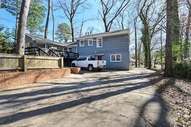 back of house with driveway