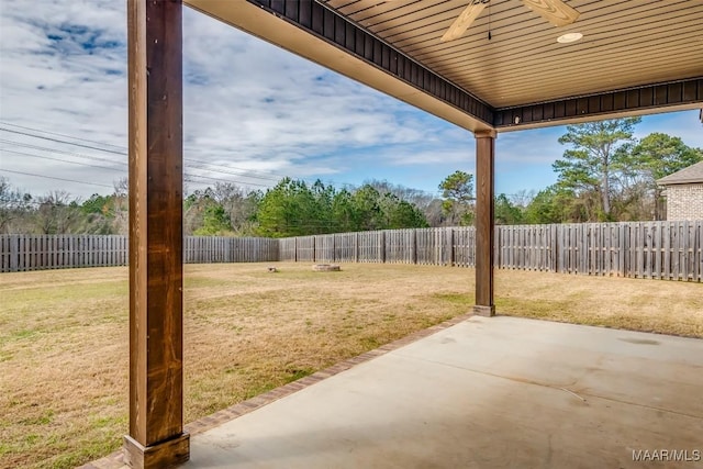 view of yard with a patio area, a fenced backyard, and ceiling fan