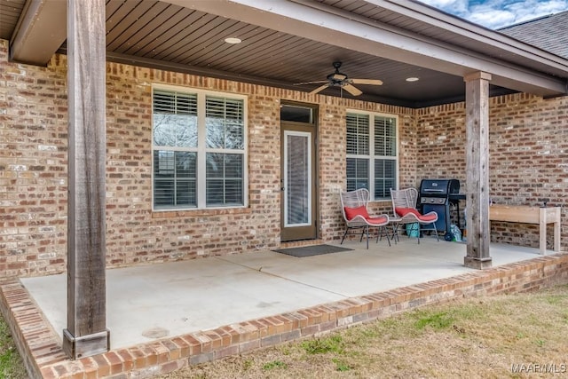 view of patio with ceiling fan and grilling area