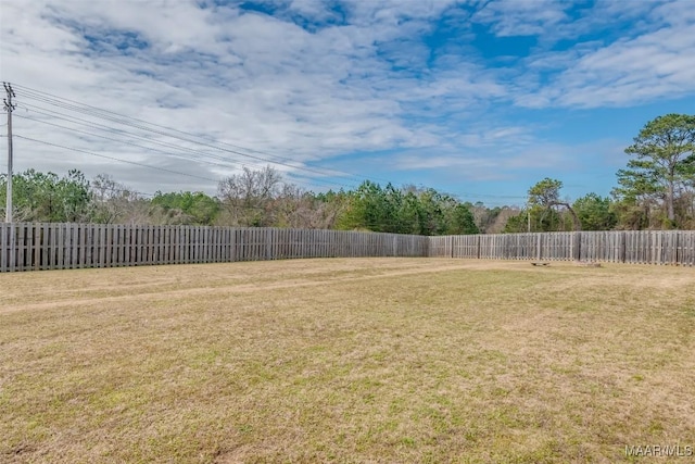 view of yard with a fenced backyard