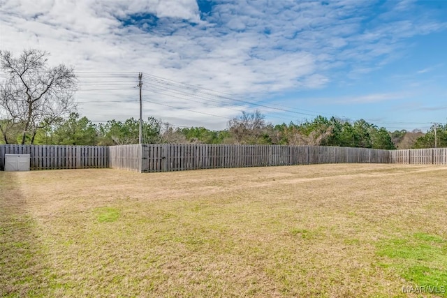 view of yard with a fenced backyard