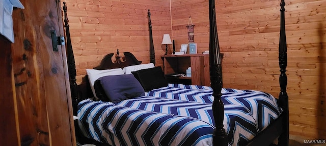 bedroom with wooden walls