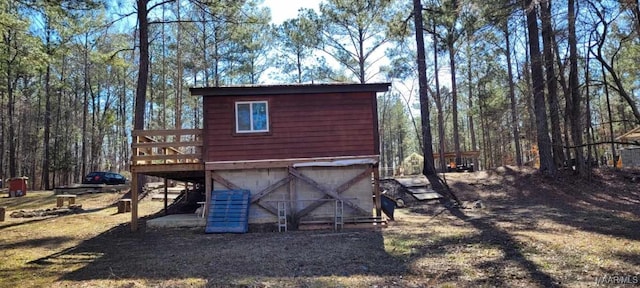 view of outbuilding featuring stairs and an attached garage