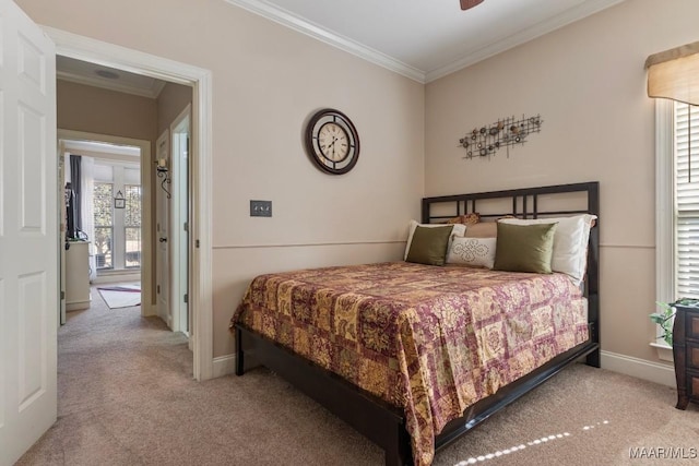 bedroom with crown molding, baseboards, and light colored carpet