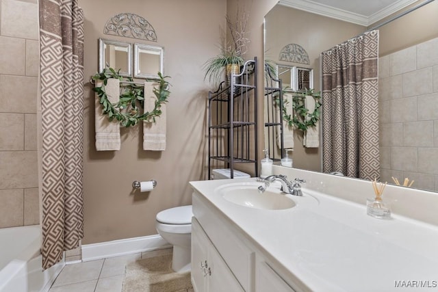 bathroom featuring tile patterned flooring, toilet, vanity, baseboards, and crown molding