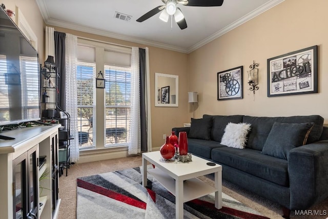 living area with ornamental molding, light colored carpet, ceiling fan, and visible vents