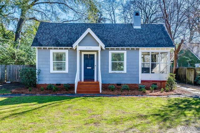 bungalow-style home featuring entry steps, fence, crawl space, a front lawn, and a chimney