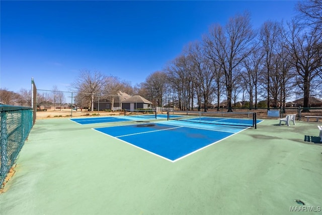 view of sport court with fence