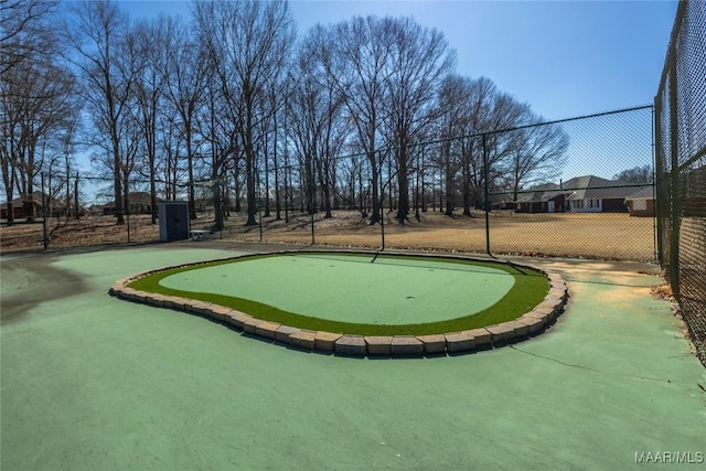 view of home's community featuring fence