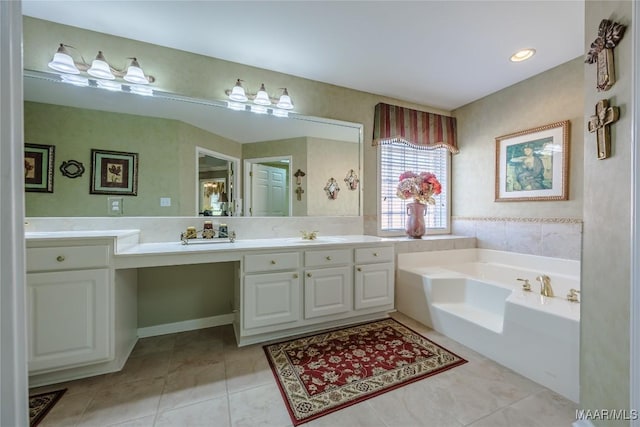 full bathroom featuring vanity, a bath, and tile patterned floors