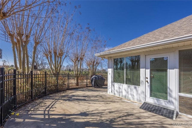 view of patio featuring fence and grilling area