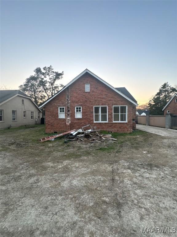 exterior space with brick siding