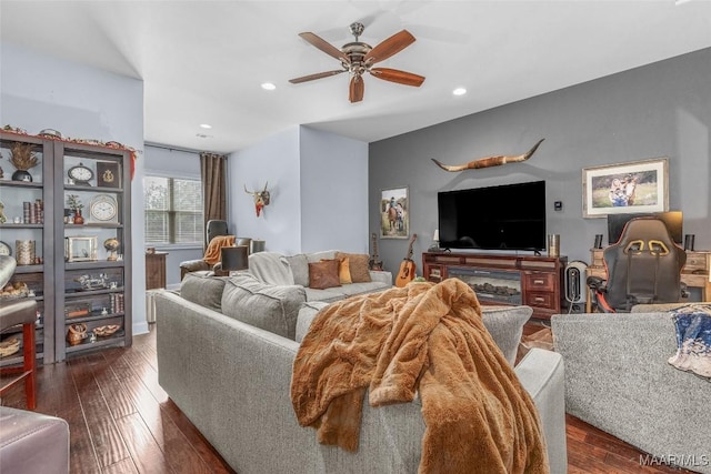 living room with a ceiling fan, dark wood-type flooring, and recessed lighting