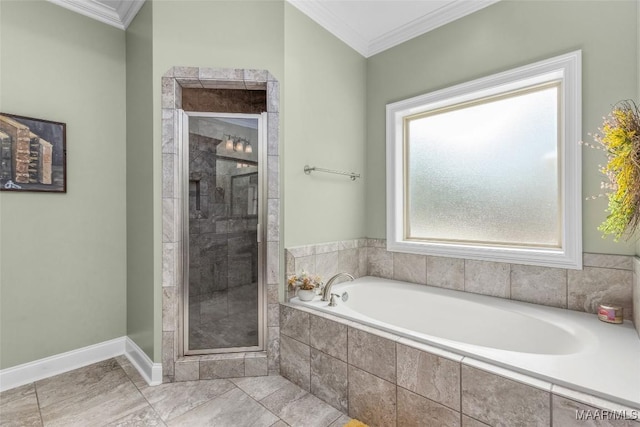 bathroom featuring a stall shower, baseboards, a garden tub, and crown molding