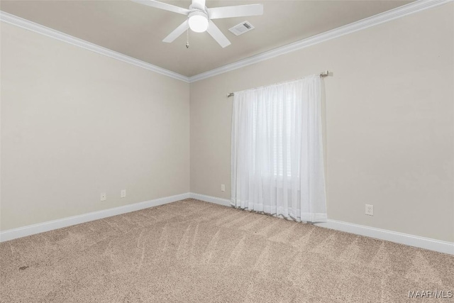 unfurnished room featuring baseboards, carpet, visible vents, and crown molding