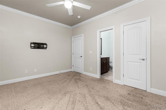 unfurnished bedroom with light carpet, ornamental molding, ensuite bath, and baseboards