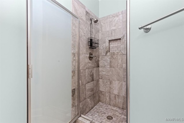 bathroom with a shower stall