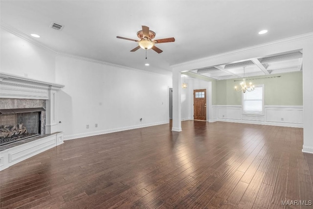 unfurnished living room with dark wood-style flooring, a fireplace, visible vents, coffered ceiling, and ceiling fan with notable chandelier