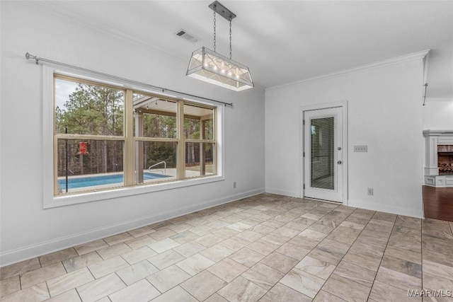 interior space with ornamental molding, visible vents, and baseboards