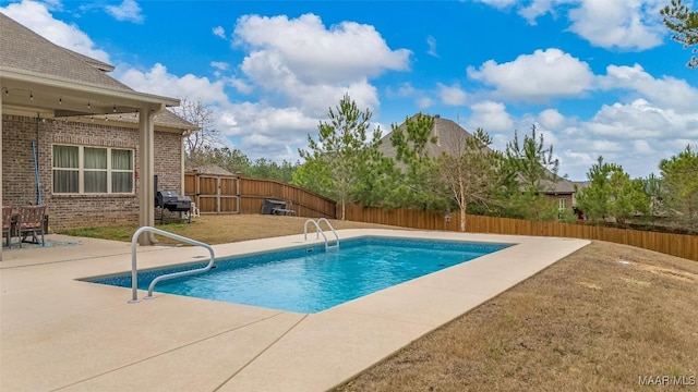 view of pool featuring a fenced in pool, a yard, a patio, a grill, and a fenced backyard